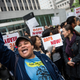 Activists calling for federal judges to reject challenges to President Barack Obama’s Deferred Action for Parents of Americans and Lawful Permanent Residents program protest outside the Jacob K. Javits Federal Building, where naturalization ceremonies take place, in New York City on May 19, 2015.
Andrew Burton/Getty Images